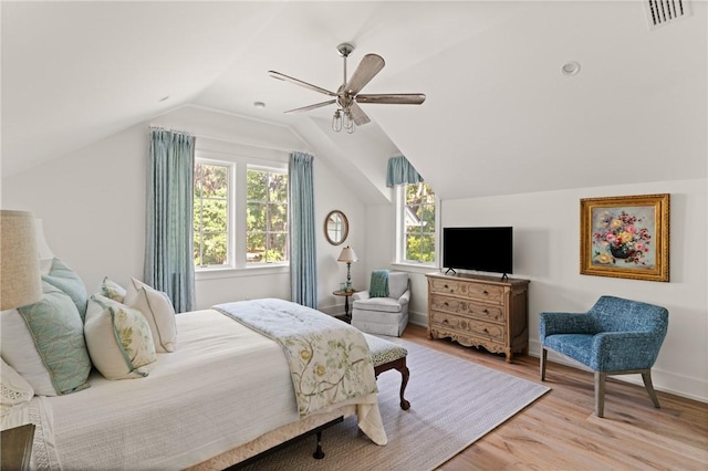 49 Hatton Ln, Saint Simons Island, GA 31522 - bedroom featuring wood finished floors, vaulted ceiling, a ceiling fan, and baseboards