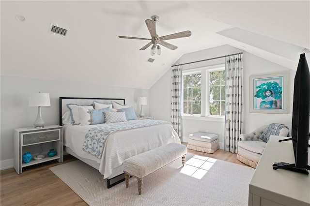 49 Hatton Ln, Saint Simons Island, GA 31522 - bedroom with light wood finished floors, vaulted ceiling, a ceiling fan, and baseboards