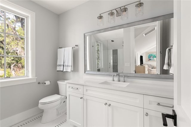 49 Hatton Ln, Saint Simons Island, GA 31522 - bathroom featuring toilet, tile patterned flooring, baseboards, a shower stall, and vanity