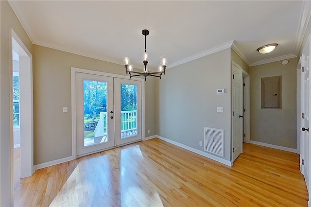 unfurnished dining area with french doors, visible vents, a chandelier, ornamental molding, and light wood-style flooring