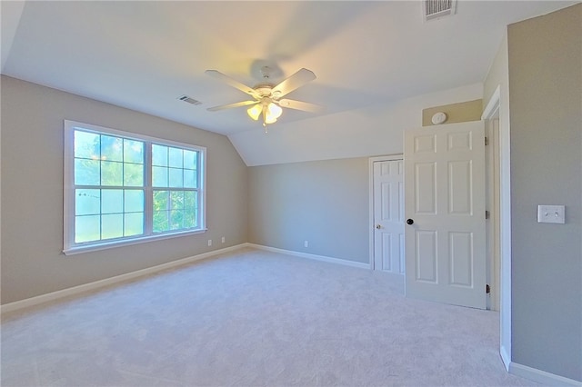 additional living space featuring baseboards, visible vents, and carpet