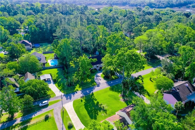 birds eye view of property with a wooded view