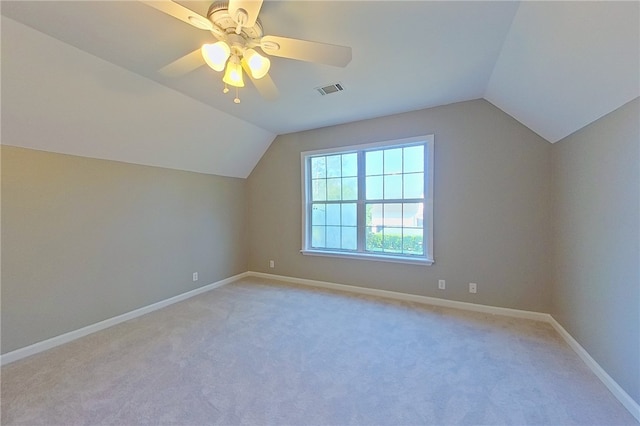 bonus room with baseboards, visible vents, and lofted ceiling