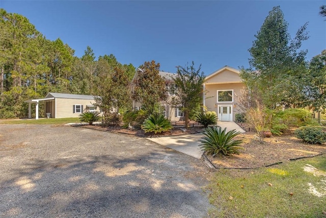 view of front of property with a carport