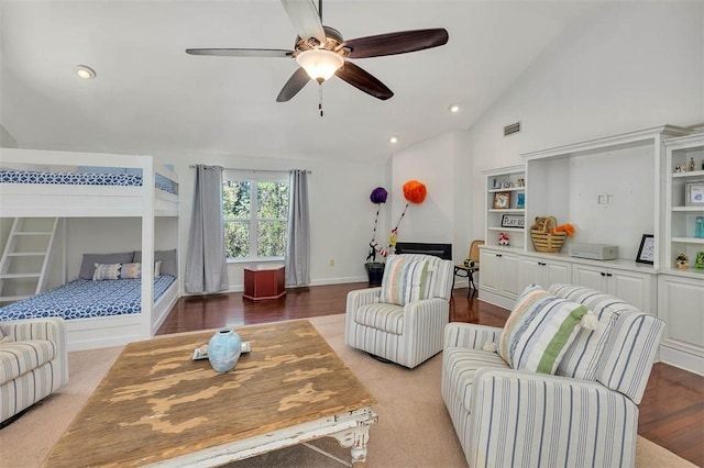 living room with ceiling fan and lofted ceiling