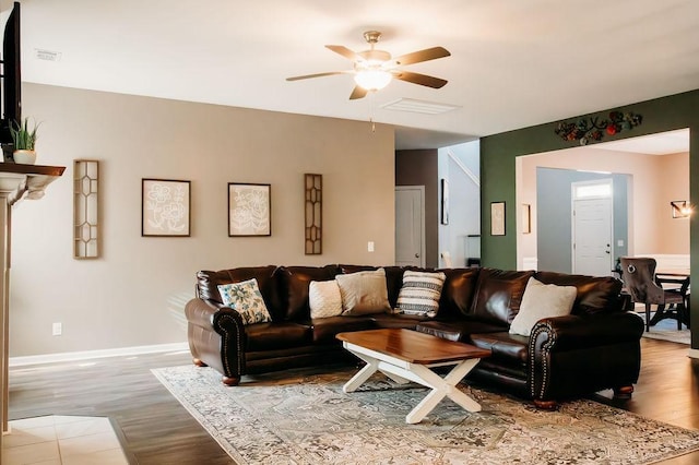 272 NE Whippoorwill Way, Ludowici, GA 31316 - living room featuring a ceiling fan, baseboards, visible vents, and wood finished floors