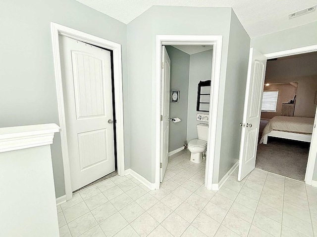 272 NE Whippoorwill Way, Ludowici, GA 31316 - bathroom featuring baseboards, tile patterned flooring, toilet, and visible vents