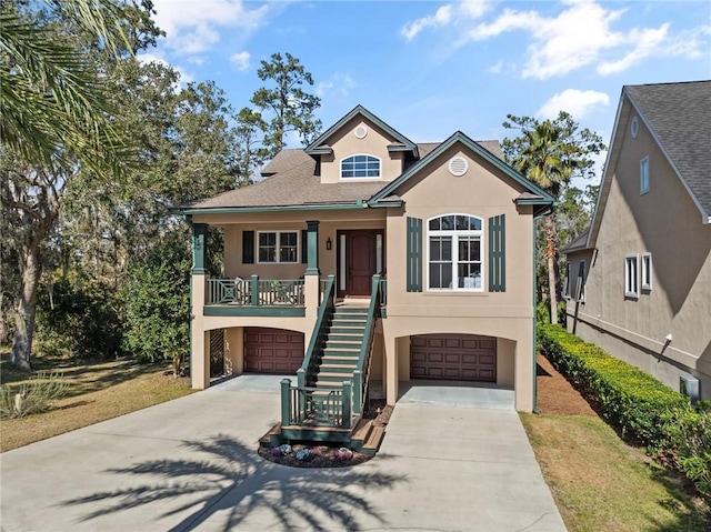 view of front of home with a garage and covered porch