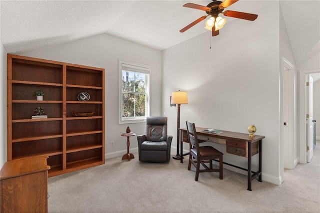 carpeted office space with ceiling fan, lofted ceiling, and a textured ceiling