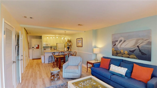 1175 N Beachview Dr Unit 389, Jekyll Island, GA 31527 - living area featuring visible vents and light wood-type flooring