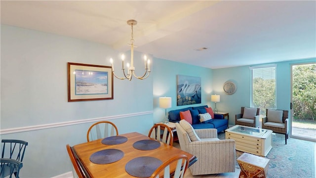 1175 N Beachview Dr Unit 389, Jekyll Island, GA 31527 - dining area with visible vents and a chandelier