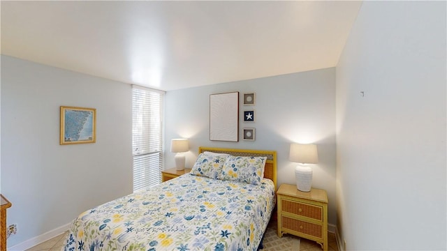 bedroom featuring light tile patterned flooring