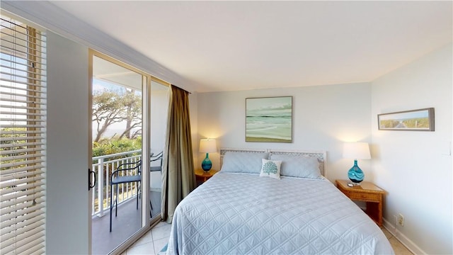 tiled bedroom featuring access to outside and multiple windows