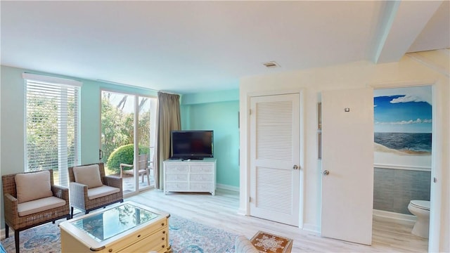 1175 N Beachview Dr Unit 389, Jekyll Island, GA 31527 - living room with visible vents, baseboards, and wood finished floors