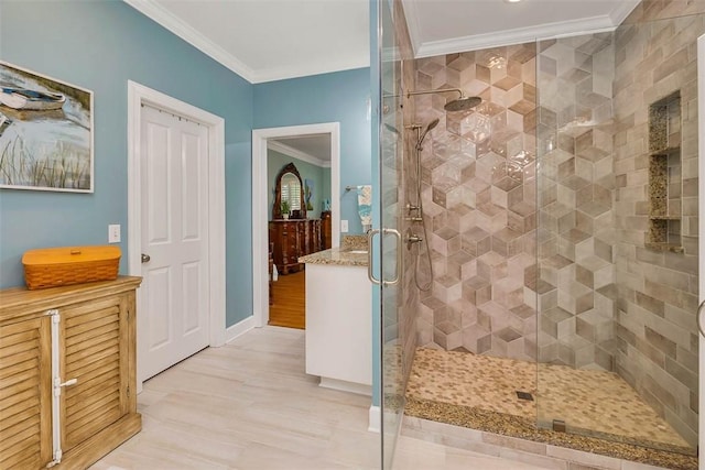 bathroom with crown molding and a stall shower