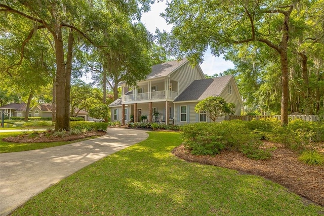 view of front of home with a balcony and covered porch