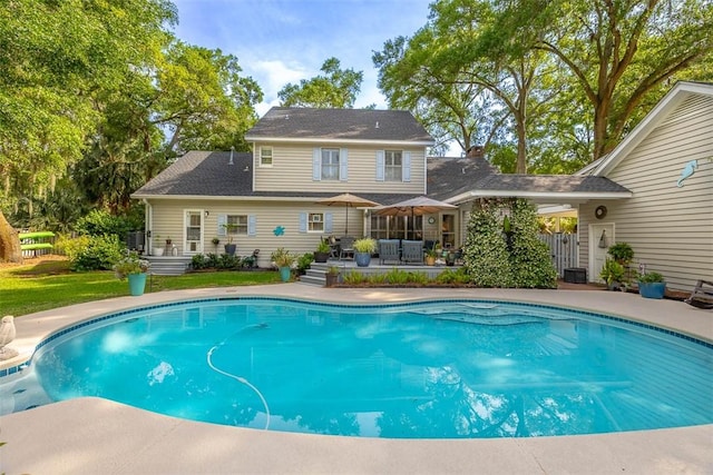 swimming pool with a patio area