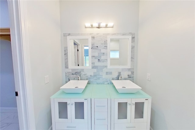 3935 Memorial Dr, Waycross, GA 31503 - full bathroom featuring marble finish floor, a sink, backsplash, and double vanity