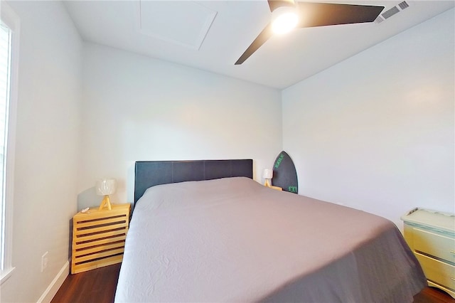 3935 Memorial Dr, Waycross, GA 31503 - bedroom featuring visible vents, attic access, ceiling fan, wood finished floors, and baseboards