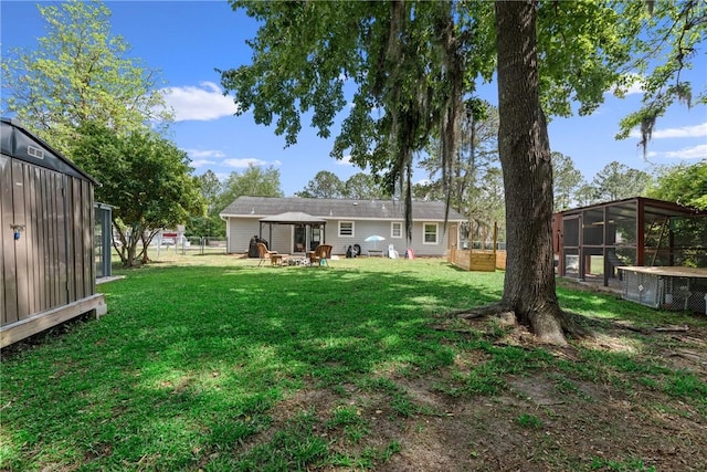 view of yard featuring fence and a gazebo