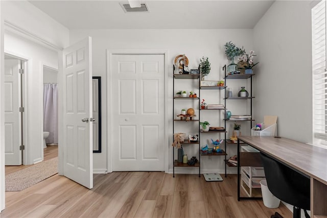 interior space with visible vents and light wood-type flooring