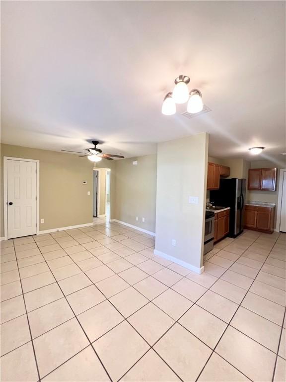 1920 Washington St, Brunswick, GA 31520 - unfurnished living room featuring light tile patterned floors and ceiling fan