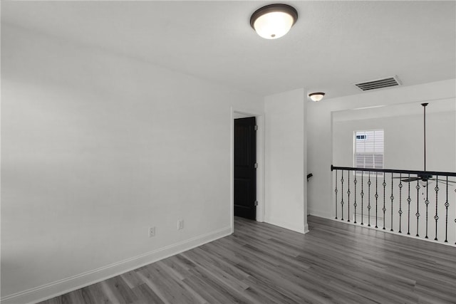 empty room featuring wood-type flooring