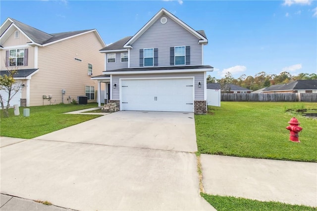 view of front of home with a front yard, a garage, and central AC unit