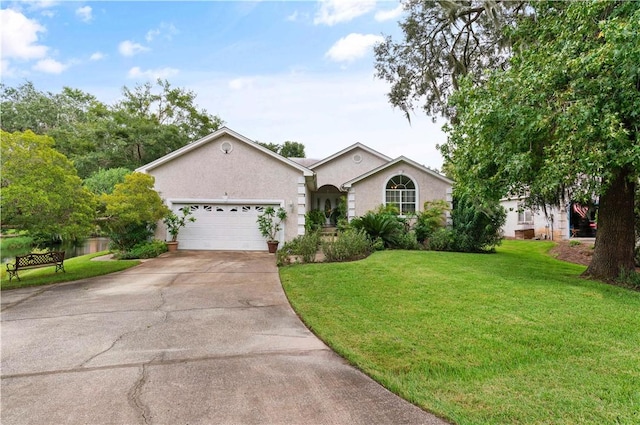 ranch-style home with a garage and a front lawn