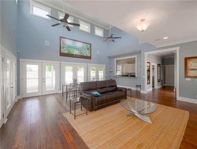 138 Mohr Club Dr, Darien, GA 31305 - living area featuring french doors, ceiling fan, crown molding, baseboards, and dark wood-style flooring