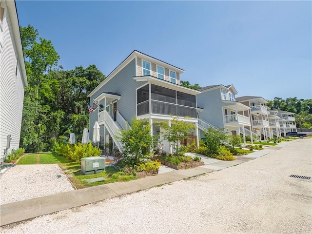 138 Mohr Club Dr, Darien, GA 31305 - view of front facade with a sunroom and stairway