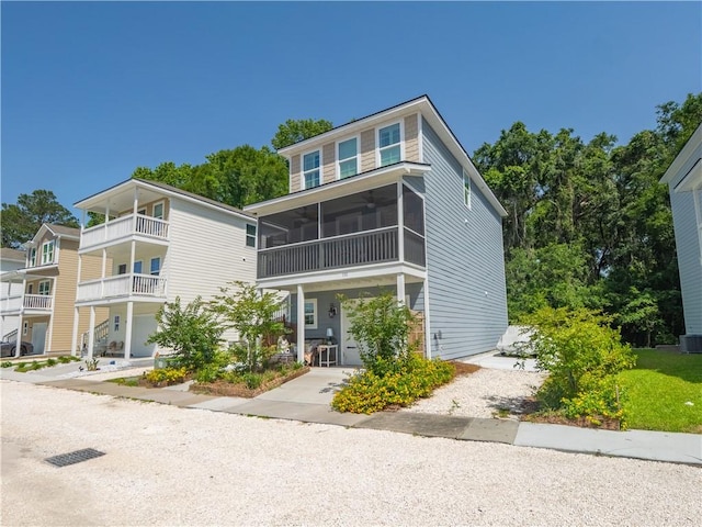 138 Mohr Club Dr, Darien, GA 31305 - view of front of house featuring ceiling fan, a sunroom, and cooling unit