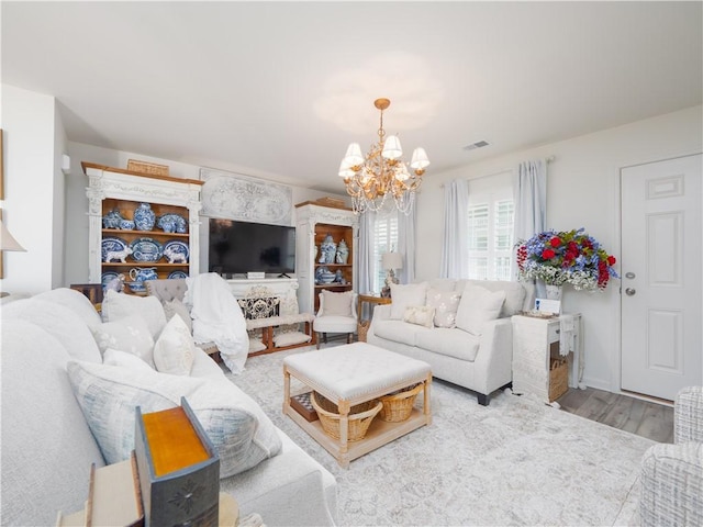138 Mohr Club Dr, Darien, GA 31305 - living room featuring a chandelier and wood finished floors