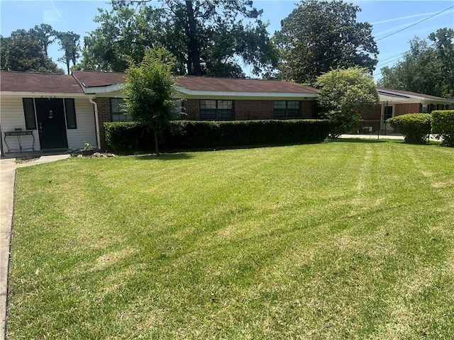 2706 Canary St, Brunswick, GA 31520 - view of front of home featuring a front yard and brick siding