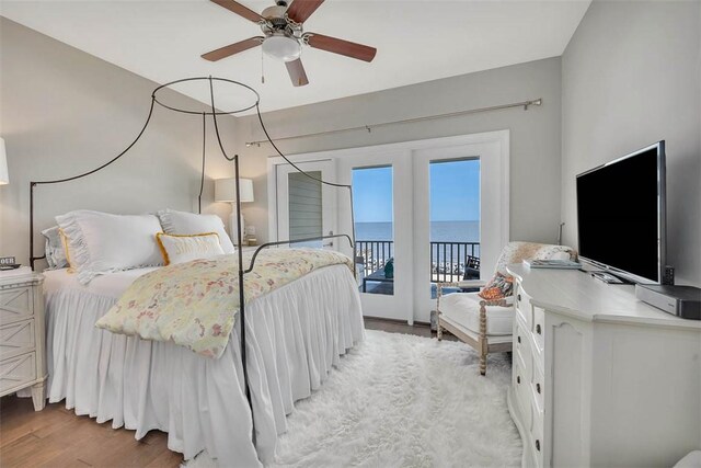 bedroom with access to outside, ceiling fan, and light wood-type flooring