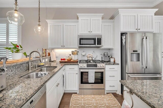 kitchen featuring white cabinetry, sink, and stainless steel appliances