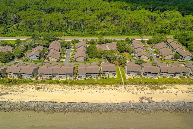 aerial view featuring a water view and a beach view