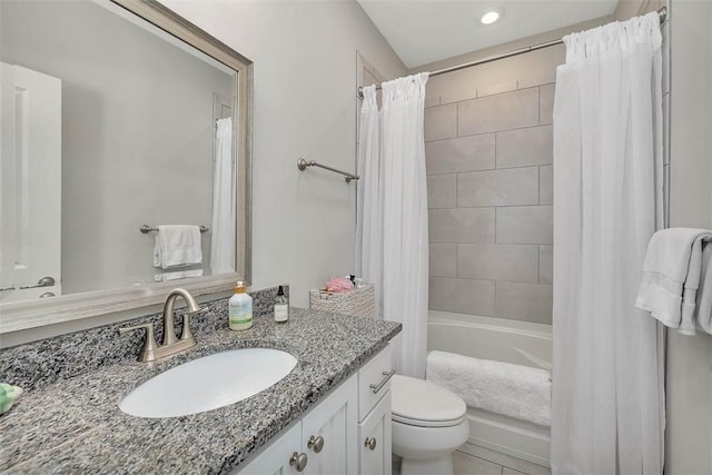 full bathroom featuring tile patterned floors, vanity, toilet, and shower / bathtub combination with curtain