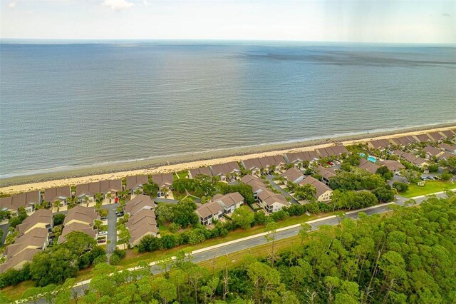 aerial view featuring a view of the beach and a water view