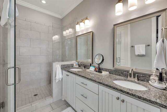 bathroom with vanity, tile patterned floors, walk in shower, and ornamental molding