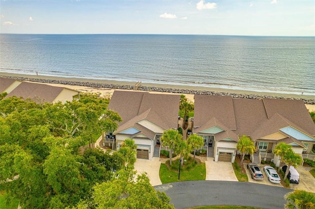 drone / aerial view with a water view and a view of the beach