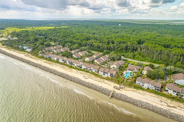 bird's eye view with a water view and a beach view