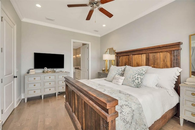 bedroom featuring ceiling fan, light hardwood / wood-style floors, ornamental molding, and connected bathroom