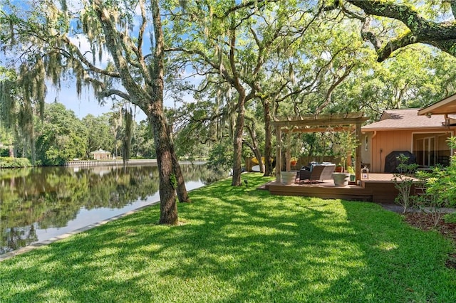 105 Driftwood Pl, Saint Simons Island, GA 31522 - view of green lawn featuring a deck with water view and a pergola