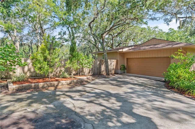 105 Driftwood Pl, Saint Simons Island, GA 31522 - view of side of property featuring driveway and a garage
