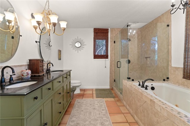 105 Driftwood Pl, Saint Simons Island, GA 31522 - bathroom with a tub with jets, double vanity, a shower stall, a chandelier, and tile patterned flooring