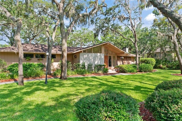 105 Driftwood Pl, Saint Simons Island, GA 31522 - rear view of house with a lawn