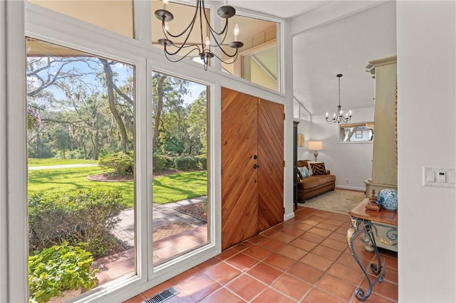 105 Driftwood Pl, Saint Simons Island, GA 31522 - entryway with a chandelier and tile patterned floors