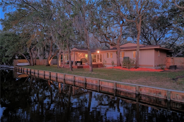 105 Driftwood Pl, Saint Simons Island, GA 31522 - rear view of house featuring a water view, an outdoor living space, and a patio