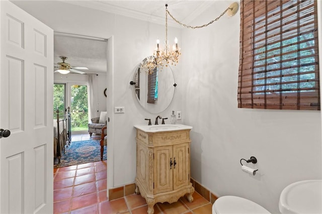 105 Driftwood Pl, Saint Simons Island, GA 31522 - half bath with vanity, tile patterned flooring, a ceiling fan, a chandelier, and crown molding